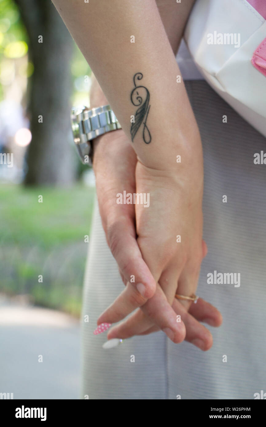 Closeup of male and female hand holding each other, on girl's hand ...