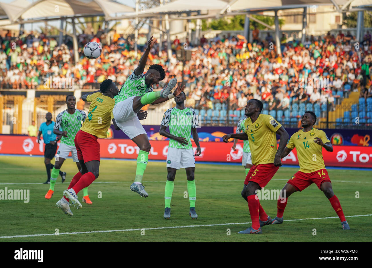 Alexandria, Egypt. 6th July 2019. FRANCE OUT July 6, 2019: Awaziem Chidozie Collins of Nigeria and Yaya Banana of Cameroon challenging for the ball during the 2019 African Cup of Nations match between Cameroon and Nigeria at the Alexanddria Stadium in Alexandria, Egypt. Ulrik Pedersen/CSM. Stock Photo