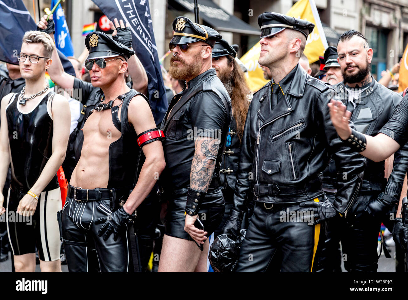 6 July 2019 - Men dressed up in biker leather jackets and peaked caps,  London Pride Parade, UK Stock Photo - Alamy