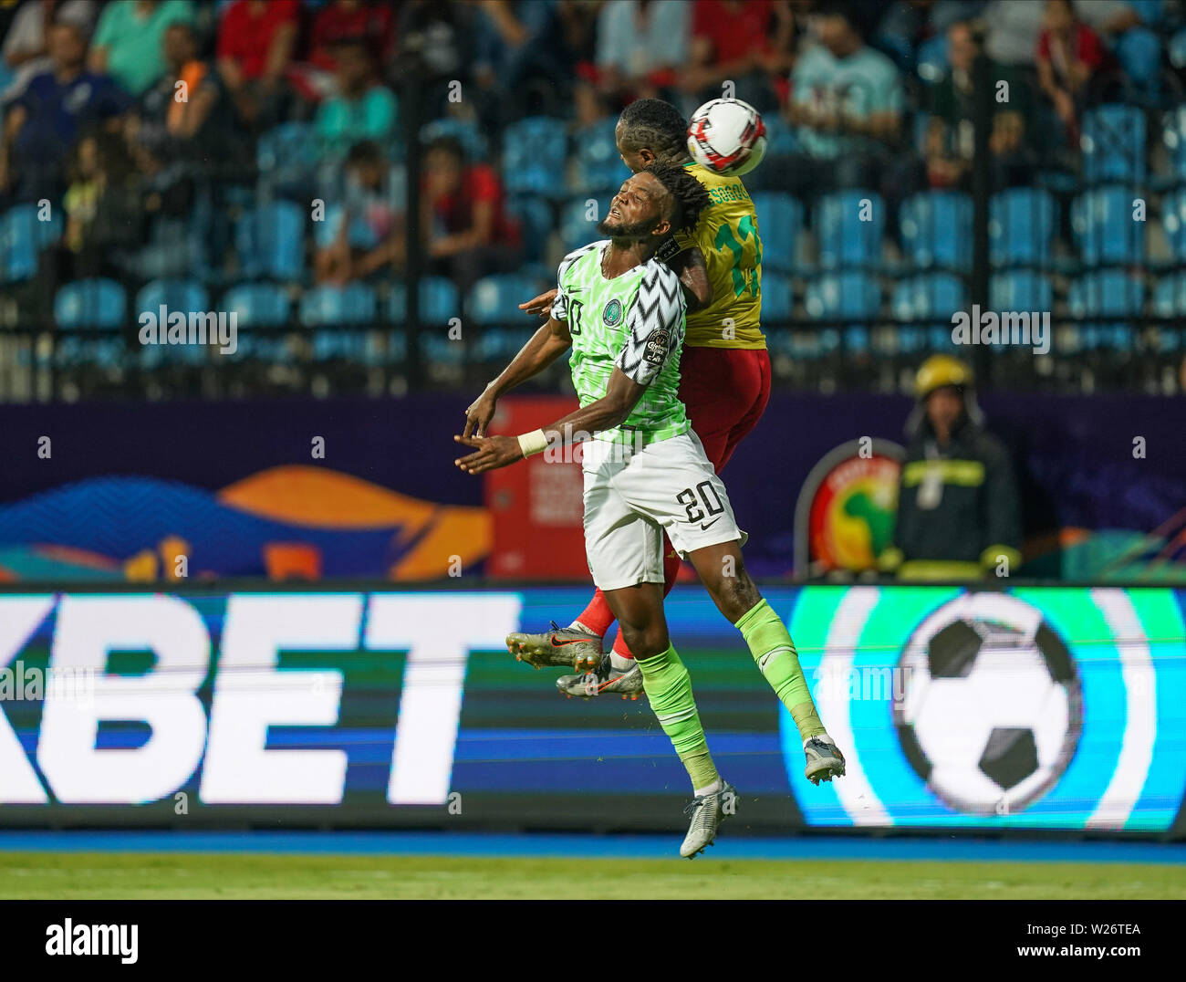 Alexandria, Egypt. 6th July 2019. FRANCE OUT July 6, 2019: Christian Mougang Bassogog of Cameroon and Awaziem Chidozie Collins of Nigeria challenging for the ball during the 2019 African Cup of Nations match between Cameroon and Nigeria at the Alexanddria Stadium in Alexandria, Egypt. Ulrik Pedersen/CSM. Stock Photo