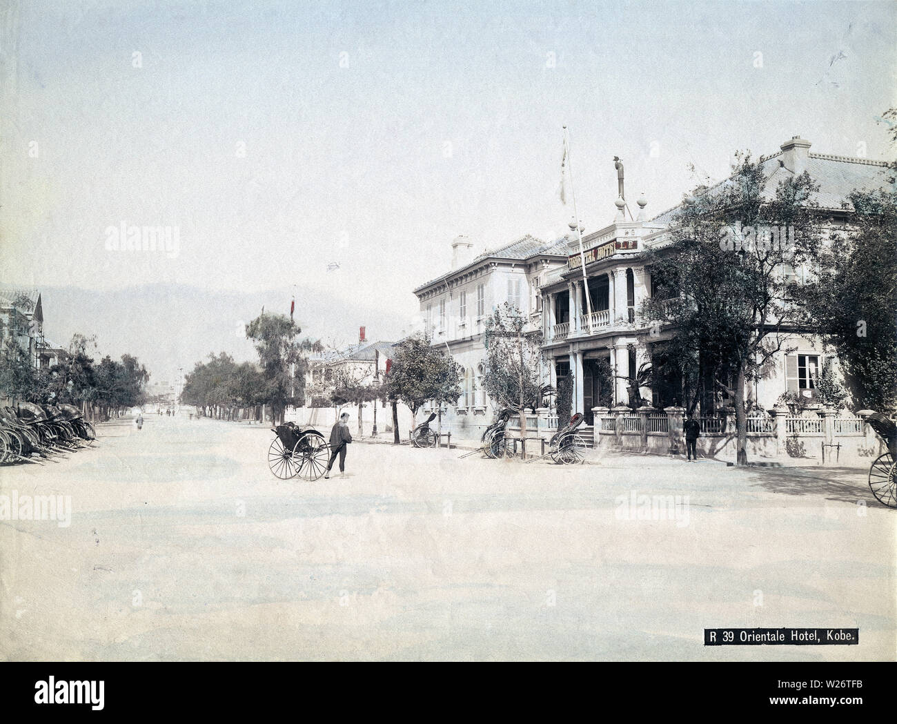 [ 1880s Japan - Oriental Hotel, Kobe ] — A jinrikisha (rickshaw) puller ...