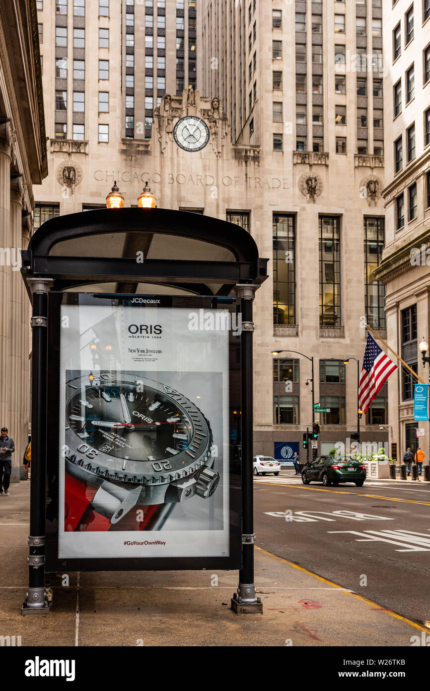 May 9, 2019. Chicago downtown. Ad billboard at bus stop for advertising, Chicago city buildings and street background. Stock Photo
