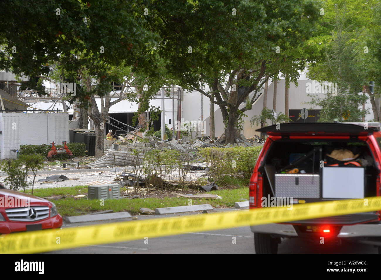 ********** NO New York POST******** PLANTATION, FL - JULY 6: Police and fire crews are combing through the rubble of an explosion that left a Florida shopping center looking like a war zone in Iraq officials said Saturday. The blast was reported at The Fountains shopping center in Plantation, just outside of Fort Lauderdale, Ruptured gas lines were found in the rubble but it has not been confirmed if the blast was caused by a gas leak according to the Plantation Police Department. About 20 people were injured, including two seriously, fire officials said on July 6, 2019 in Plantation, Florida Stock Photo