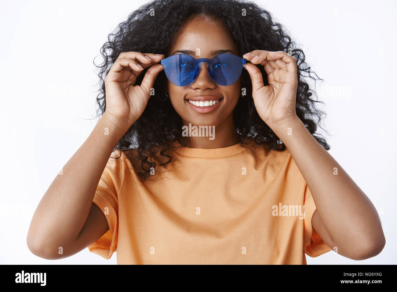 Girl find perfect pair sunglasses make fuss campus. Charming african