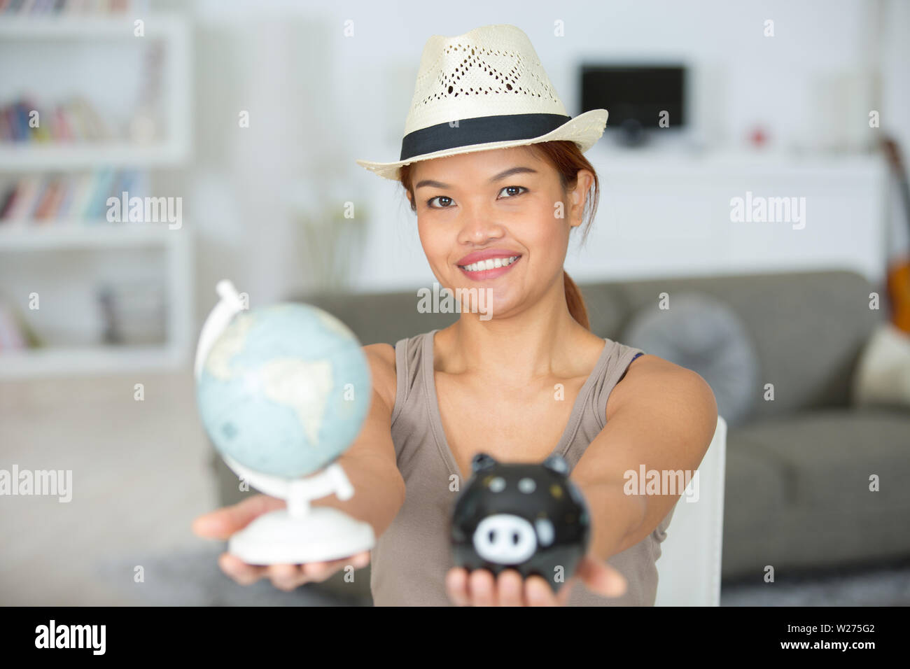 piggy bank laptop globe holiday caption Stock Photo Alamy