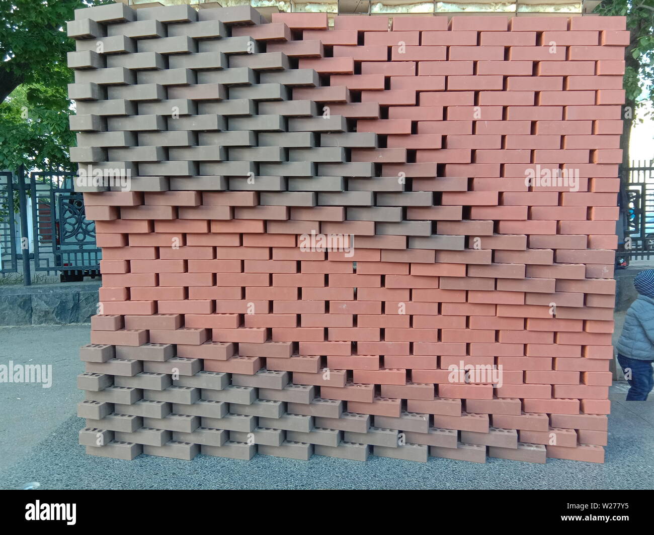 Figured masonry walls, dry, red brick without cement - an abstract picture. Russia Stock Photo