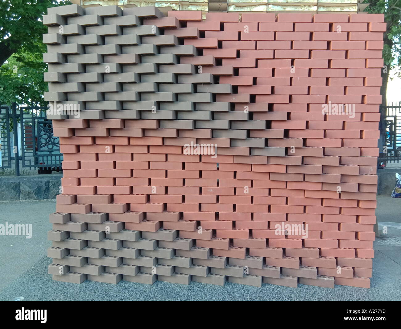 Figured masonry walls, dry, red brick without cement - an abstract picture. Russia Stock Photo