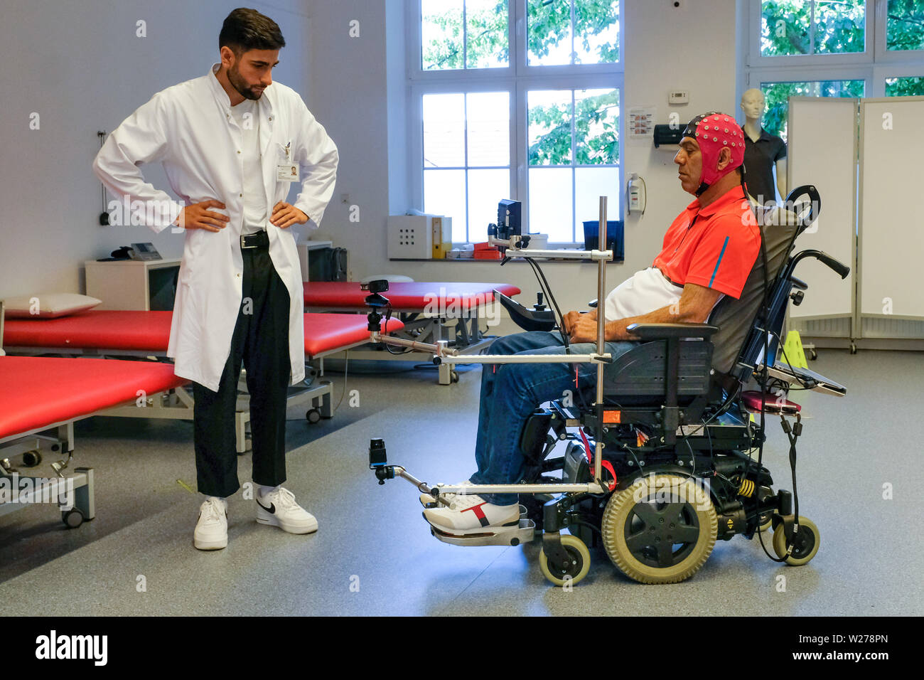 Bochum, Germany, 17.June 2019. In a pilot project, the first patients at Bochum University Hospital Bergmannsheil have successfully completed a training session to steer a wheelchair through thought power. The pilot project for the so-called Brain Computer Interface (BCI), the interface between the brain and the computer, has been running for about a year at the hospital in the Ruhr area. Four patients have now completed the twelve-week training successfully and are able to drive a course with different direction changes with the power of their thoughts. Stock Photo