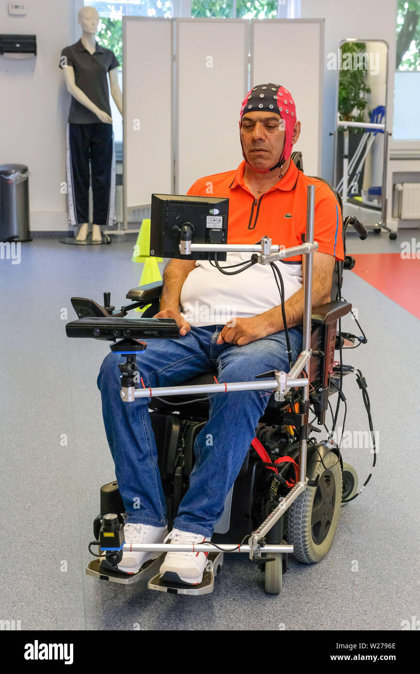 Bochum, Germany, 17.June 2019. In a pilot project, the first patients at Bochum University Hospital Bergmannsheil have successfully completed a training session to steer a wheelchair through thought power. The pilot project for the so-called Brain Computer Interface (BCI), the interface between the brain and the computer, has been running for about a year at the hospital in the Ruhr area. Four patients have now completed the twelve-week training successfully and are able to drive a course with different direction changes with the power of their thoughts. Stock Photo