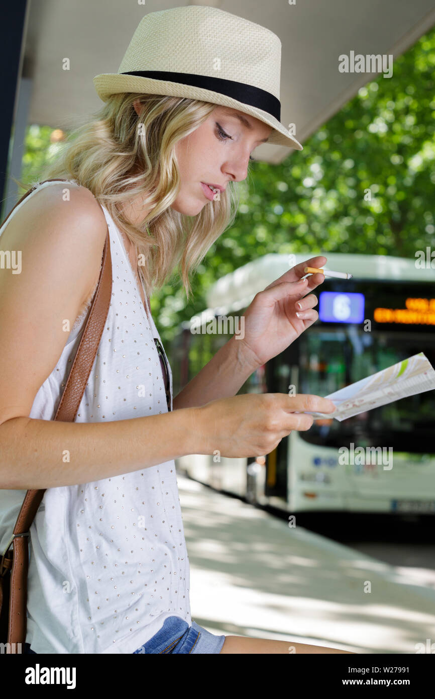 Woman bus stop rear view hi-res stock photography and images - Alamy
