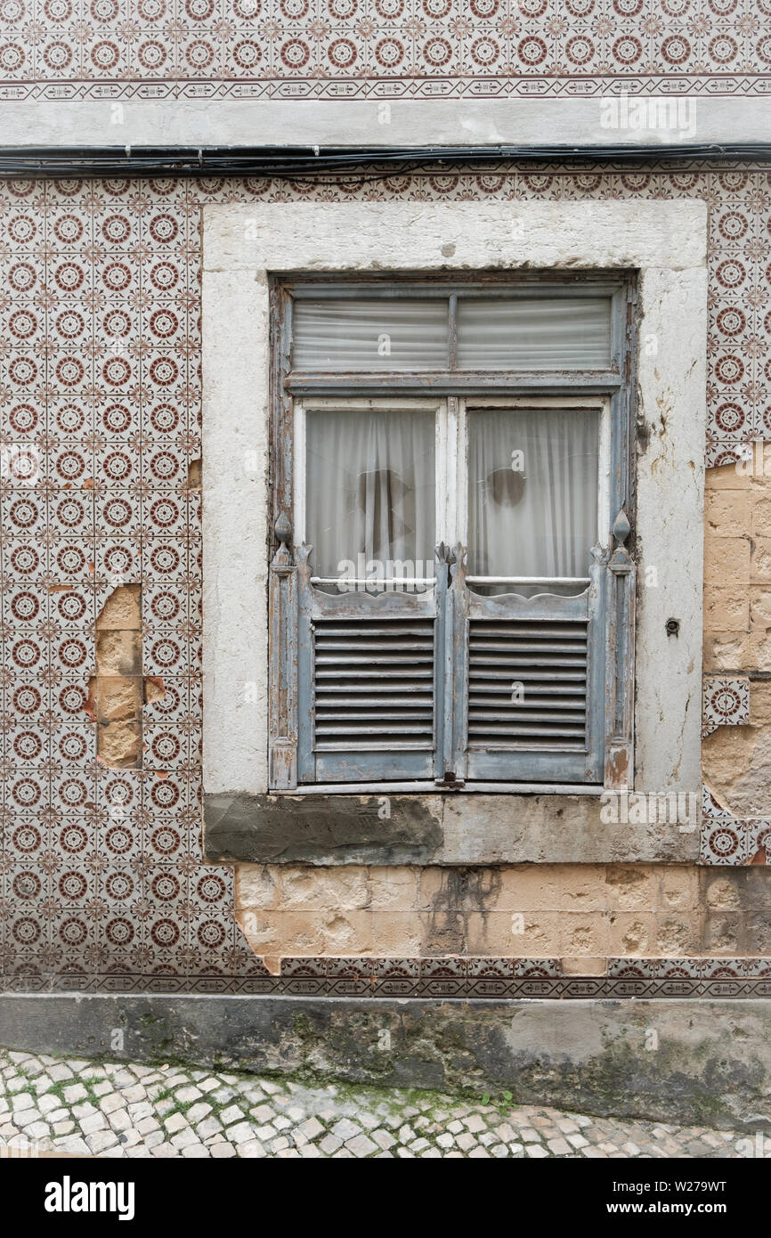 Gray window shutters and grunge wall background Stock Photo - Alamy