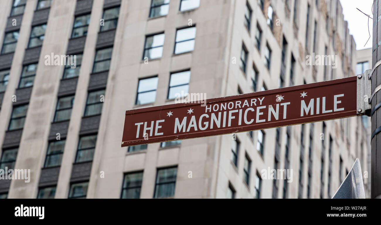 Chicago city downtown, The magnificent mile brown color street sign, City high rise buildings background, closeup view Stock Photo