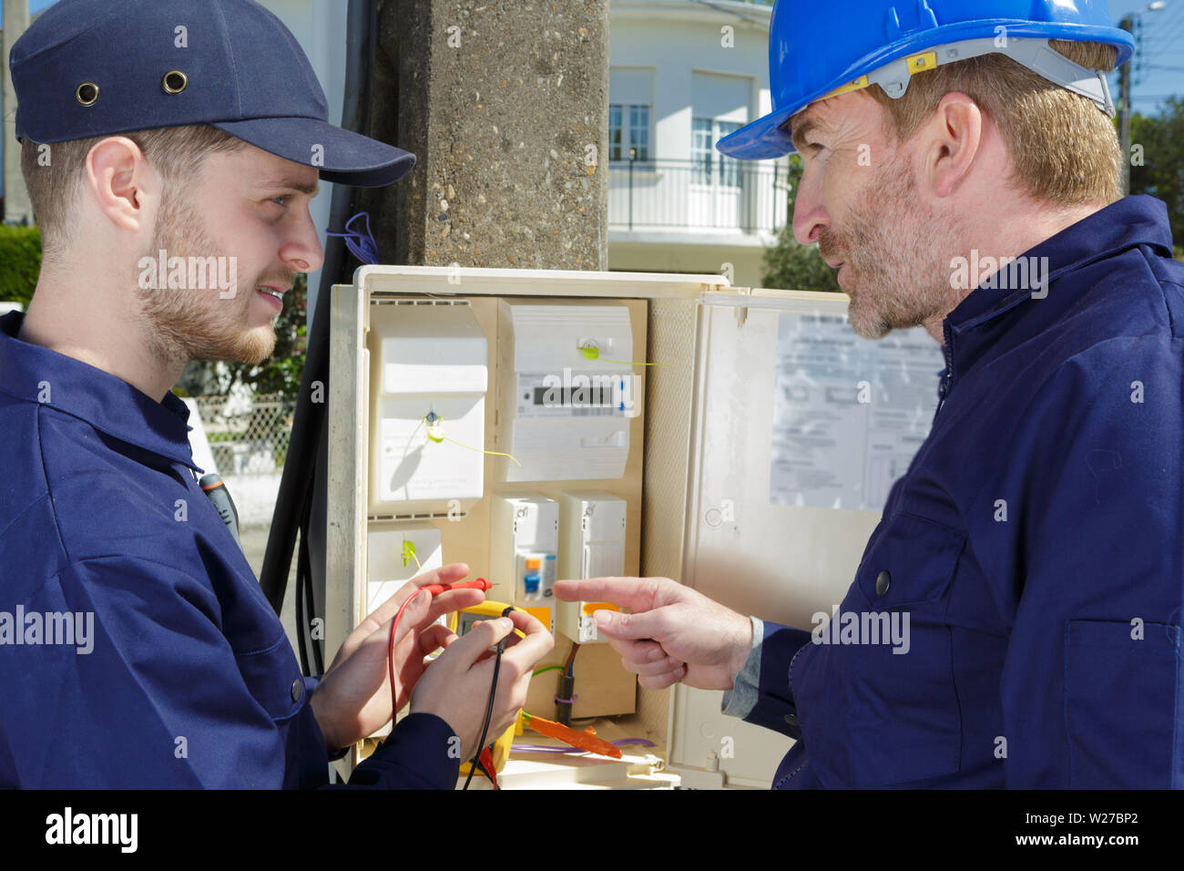 electrician opening an outdoor fuse box Stock Photo Alamy