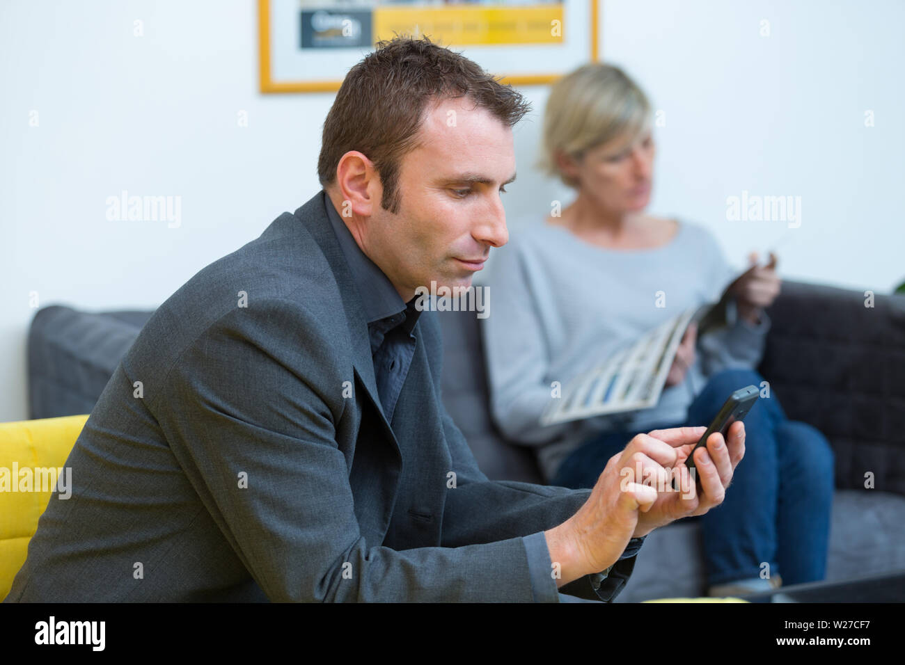 two people waiting in the waiting room Stock Photo - Alamy