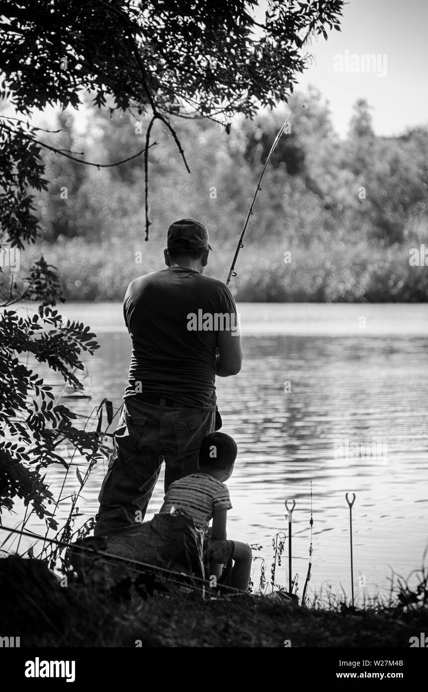 Fishing on the lake in black and white. Stock Photo