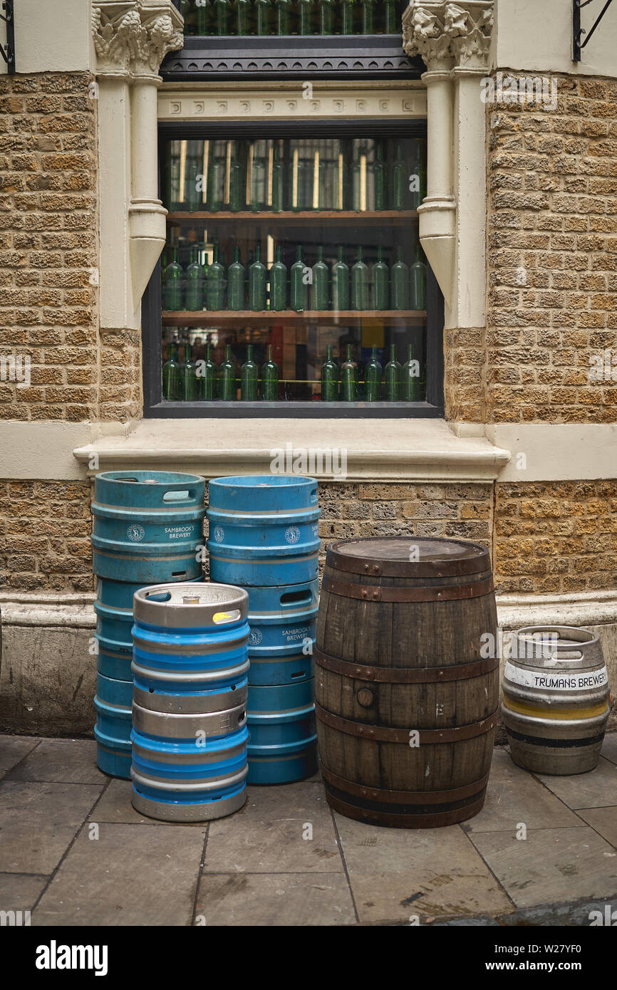 London, UK - April, 2019. Metal and wooden barrels of beer outside the Globe Tavern, an old public house in Borough Market. Stock Photo