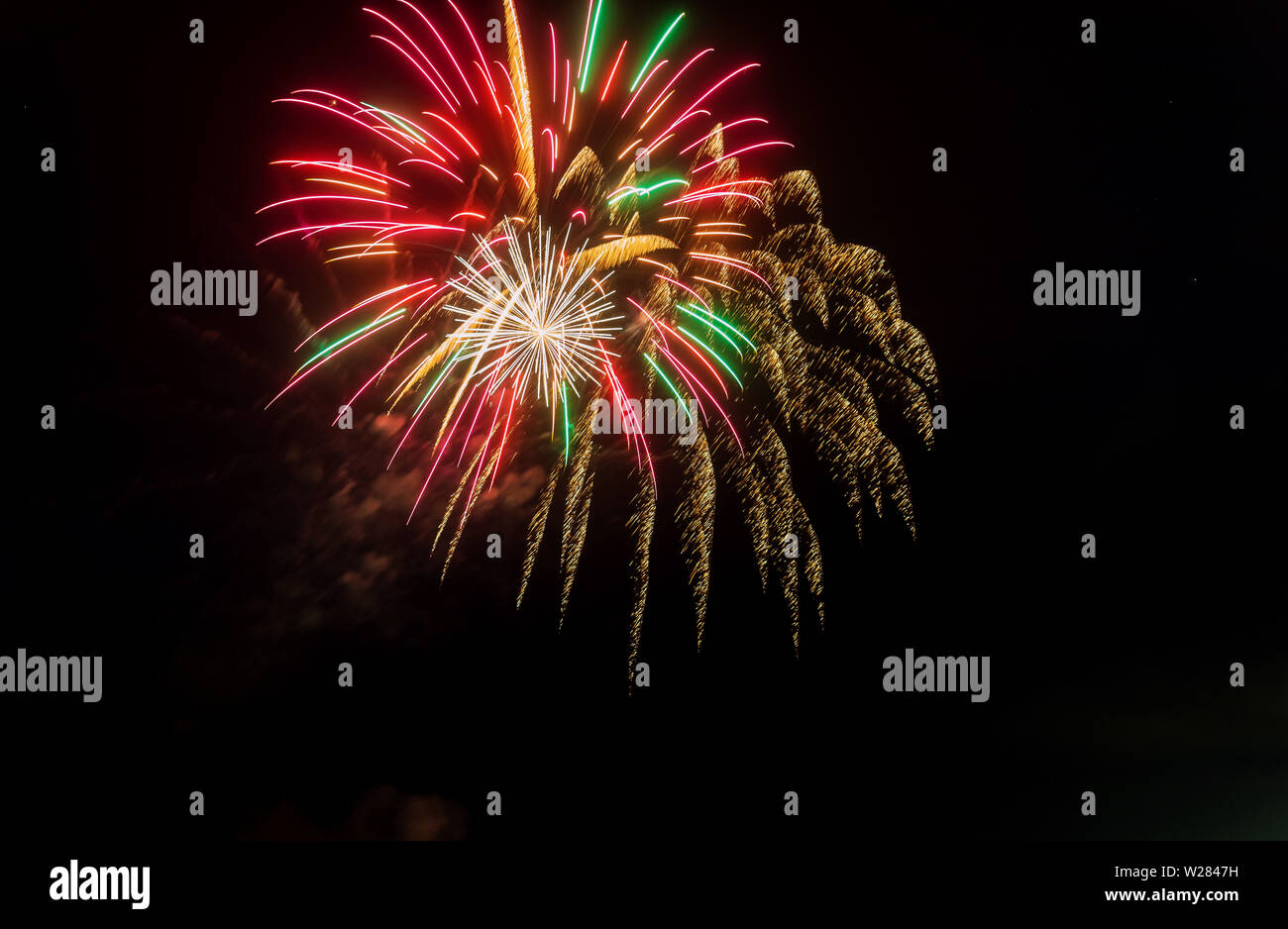 Night fireworks different colors glittering sparkle fireworks on a