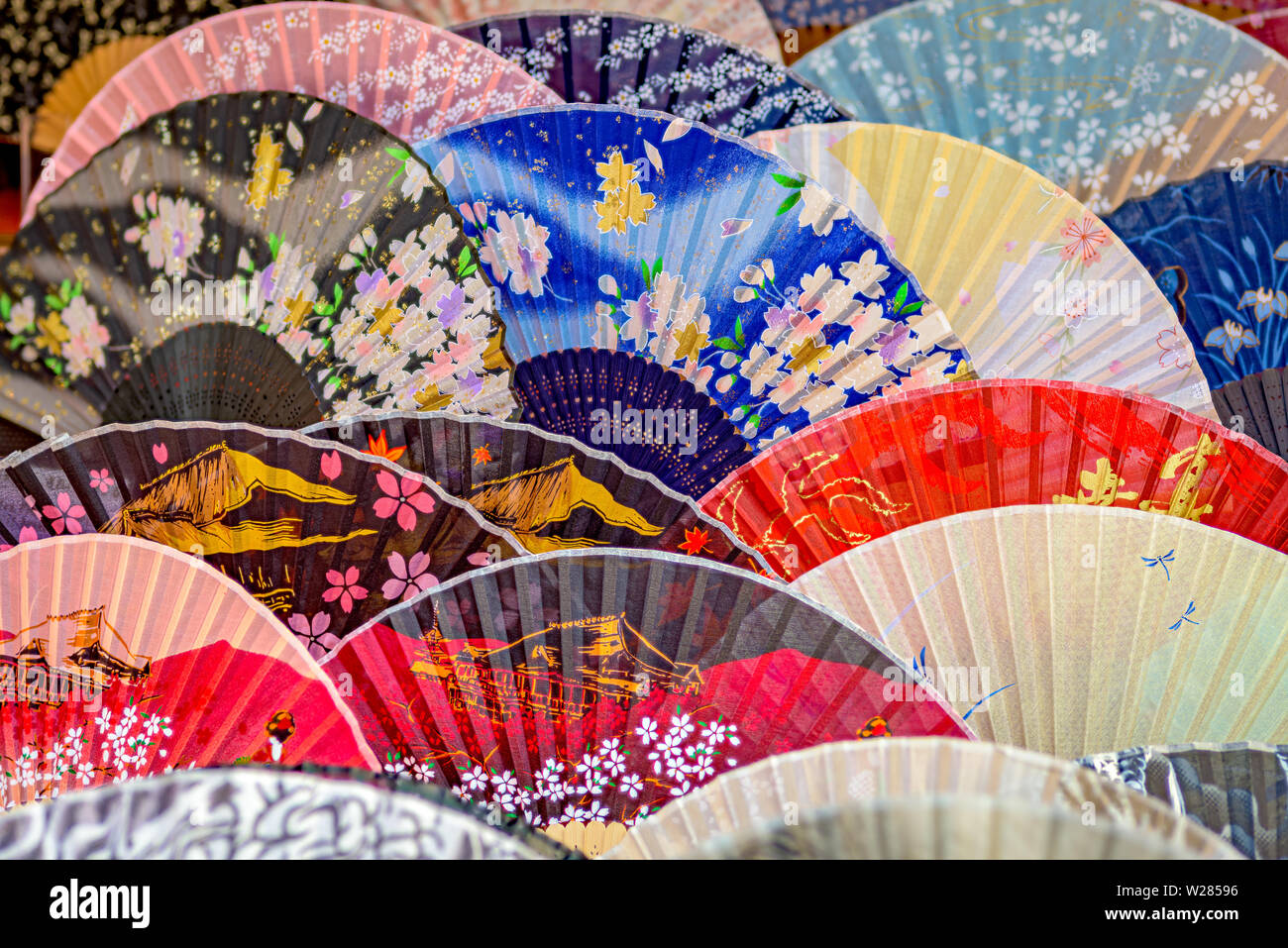 Color fans used for cooling with colors and patterns Stock Photo - Alamy