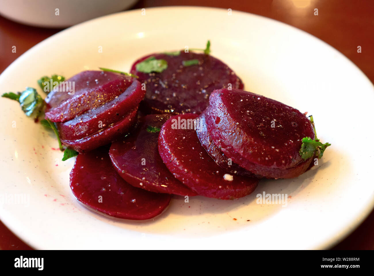 A plate of cooked sliced beets as a side dish or a salad Stock Photo