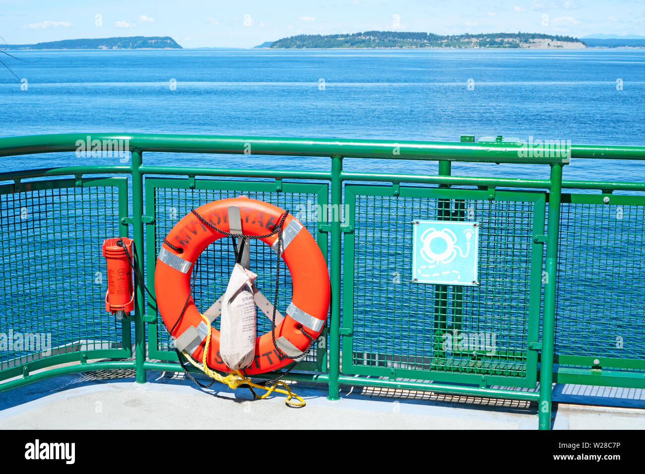 Mukilteo WA - May 18 2019. A life saving belt by the railing on a ferry boat. Stock Photo
