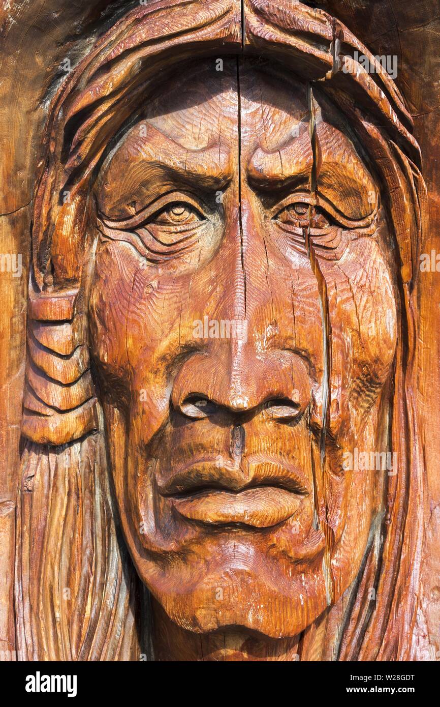 Salish Native Indian Wood Carving Totem Pole Art Face Sculpture Campbell River Waterfront Pacific Northwest Vancouver Island British Columbia Canada Stock Photo