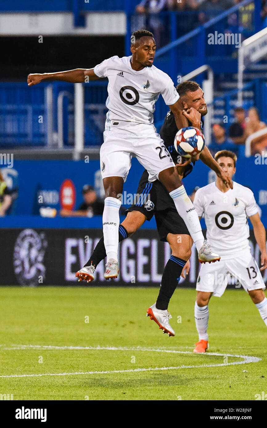 Montreal, QC, Canada. 06th July, 2019. Minnesota United FC forward Mason Toye (23) and Montreal Impact defender Rudy Camacho (4) miss the ball while jumping in the air during the Minnesota United FC at Montreal Impact game at Saputo Stadium in Montreal, QC, Canada. David Kirouac/CSM/Alamy Live News Stock Photo