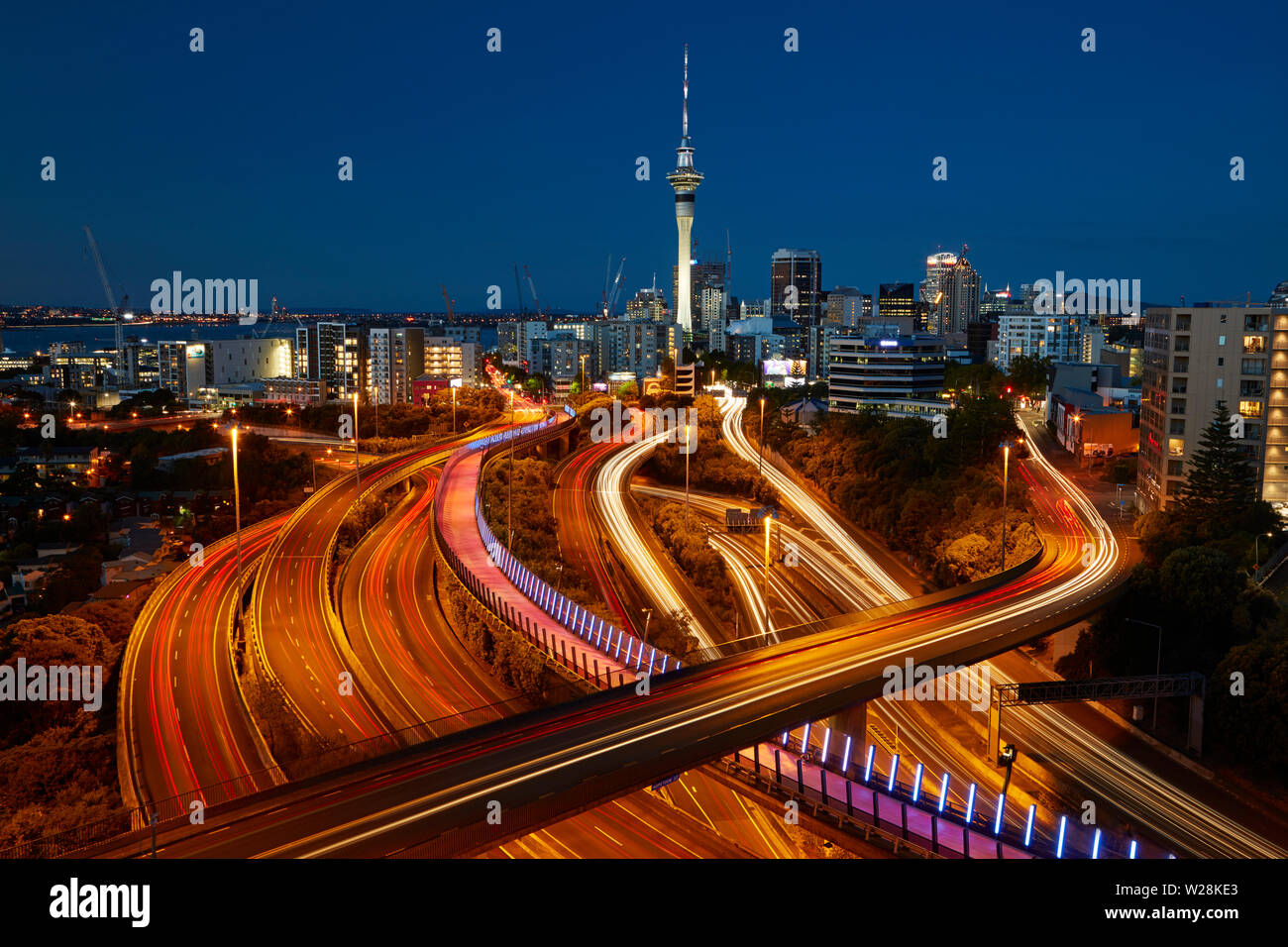Motorways, Lightpath cycleway, and Sky Tower at dusk, Auckland, North ...