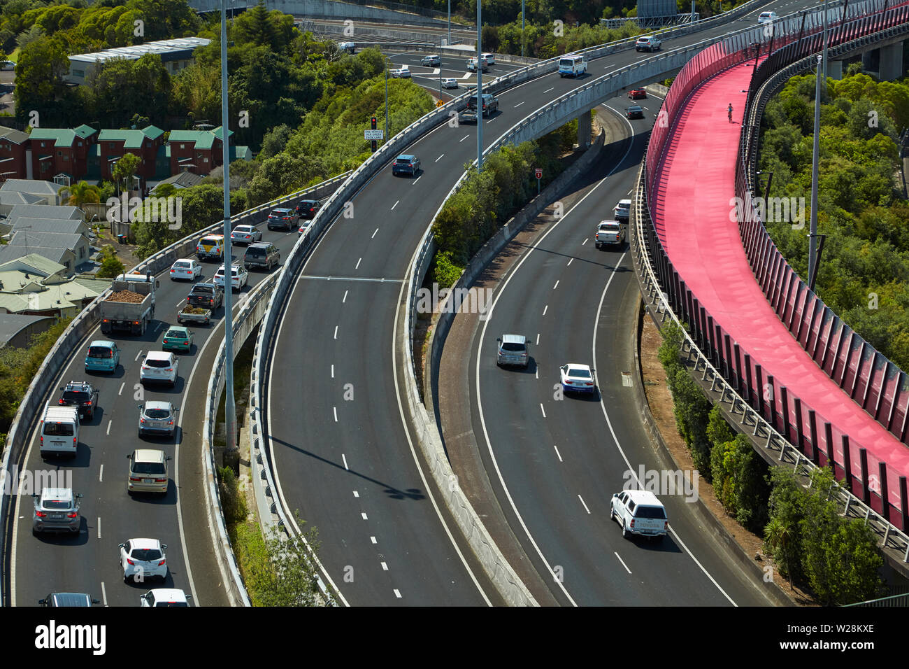 Commuters on motorways, and Lightpath cycleway, Auckland, North Island, New Zealand Stock Photo