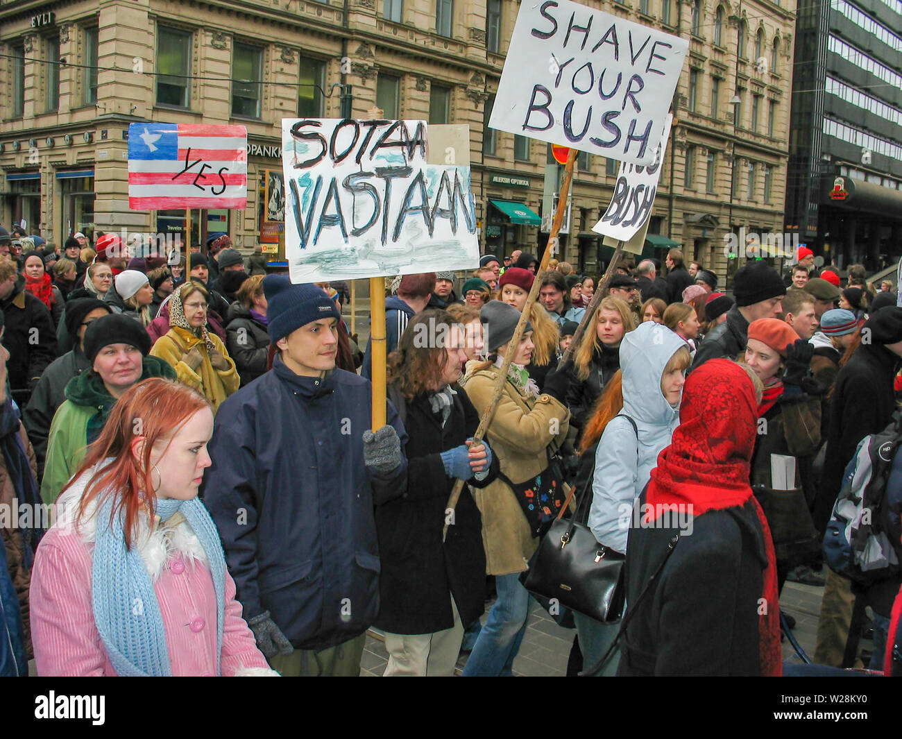 Helsinki, Finland - March 22, 2003: Anti-war protesters march through downtown Helsinki to protest the impending United States invasion of Iraq. Stock Photo