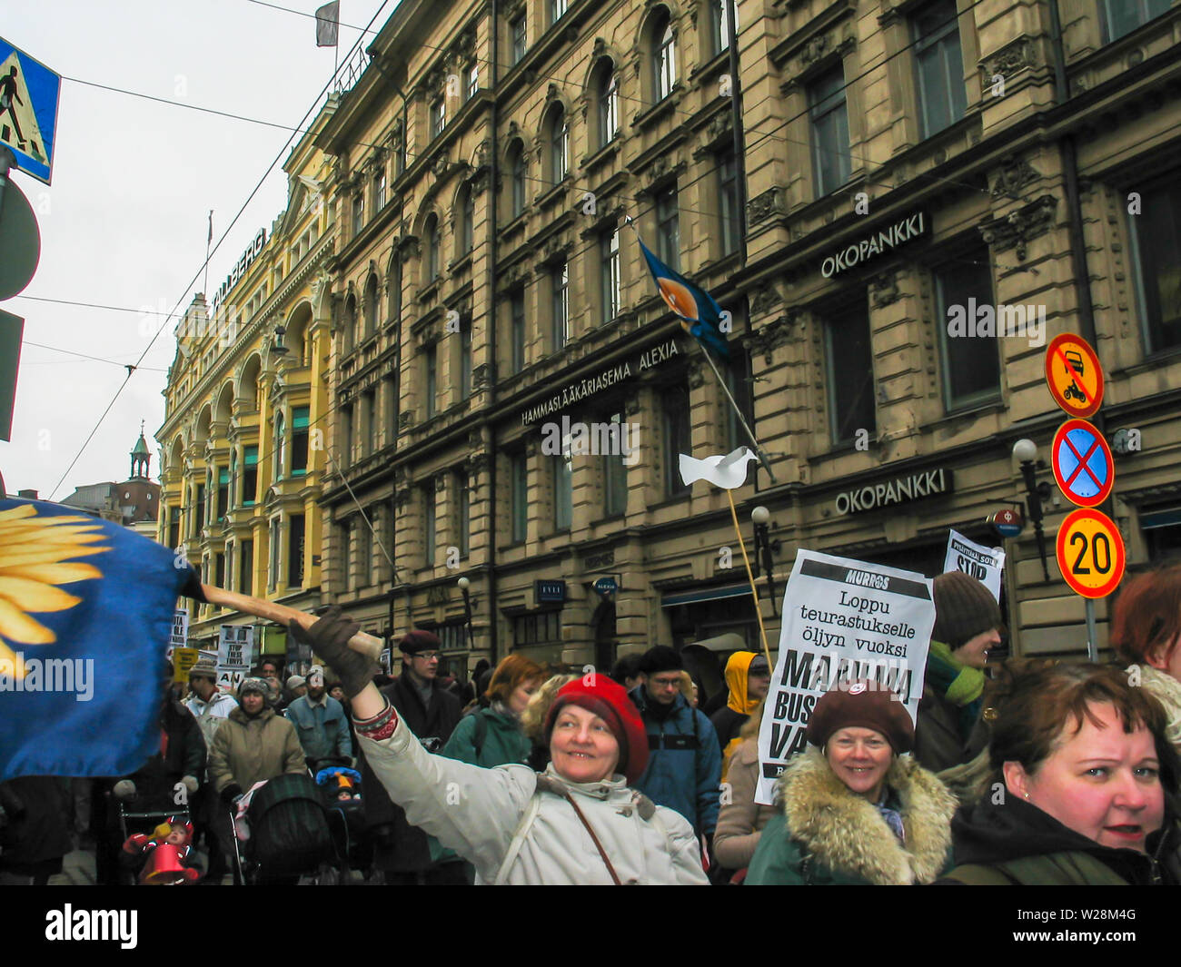 Helsinki, Finland - March 22, 2003: Anti-war protesters march through downtown Helsinki to protest the impending United States invasion of Iraq. Stock Photo