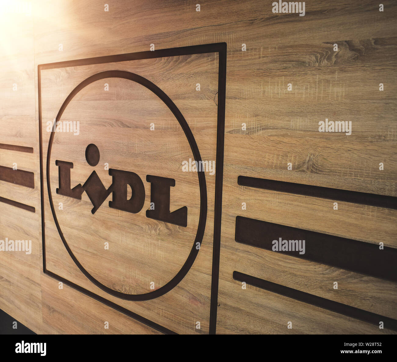 Budapest, Hungary: May/22/2019 - Lidl logo engraved on wooden board inside one of the biggest stores in Hungary. Stock Photo