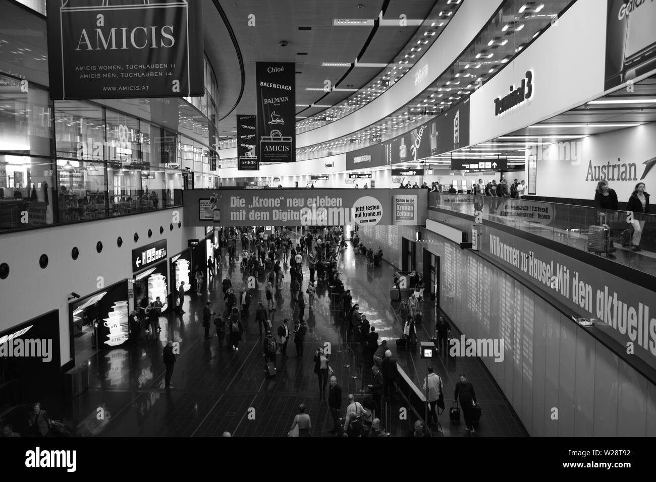 Vienna, Austria: May/20/2019 - Vienna International Airport (built in 1938 and the largest airport in Austria). People waiting for the arrivals to com Stock Photo