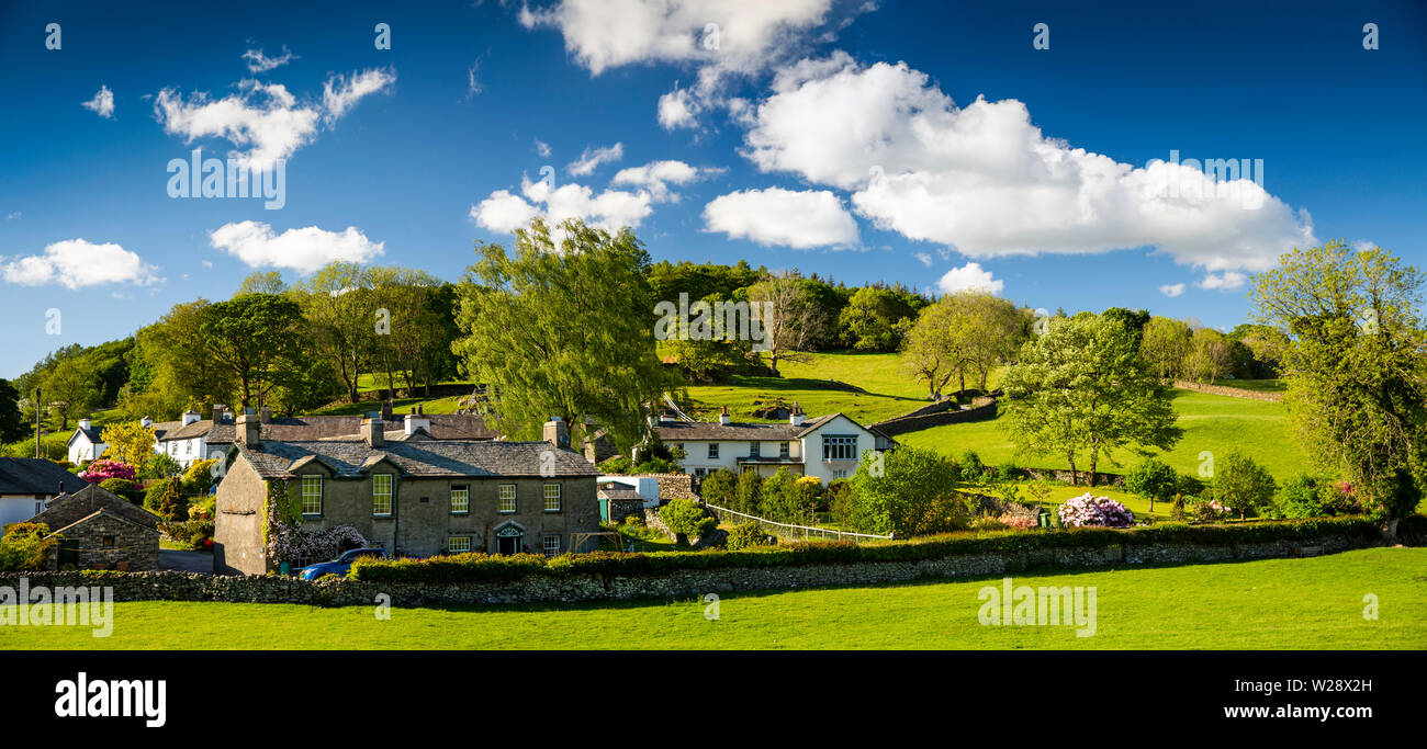 UK, Cumbria, Hawkshead, Near Sawrey, village houses beside Stones Lane and Bank Wood, panoramic Stock Photo