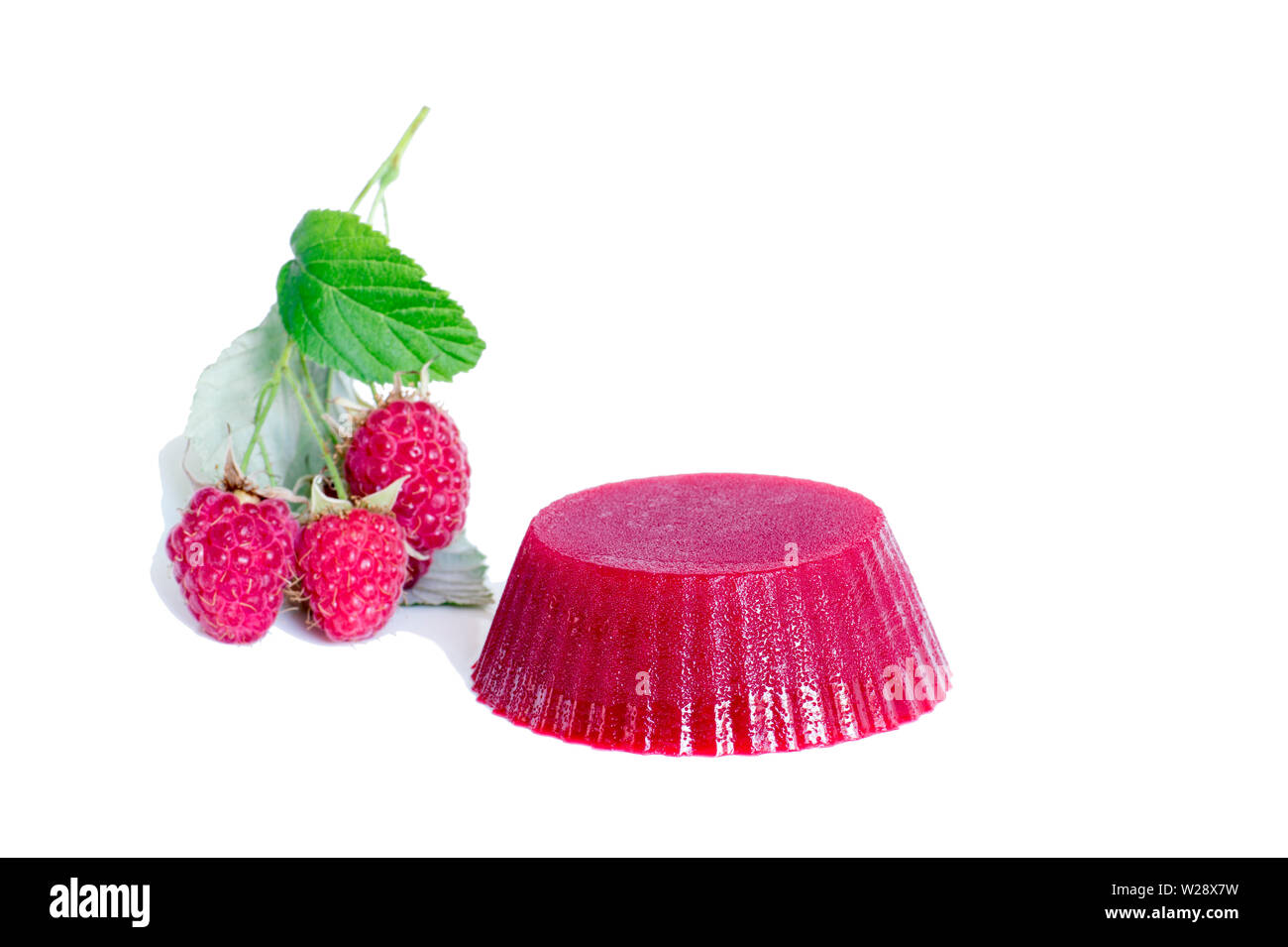 Raspberry jelly with raspberry berries on a sprig isolated on a white ...