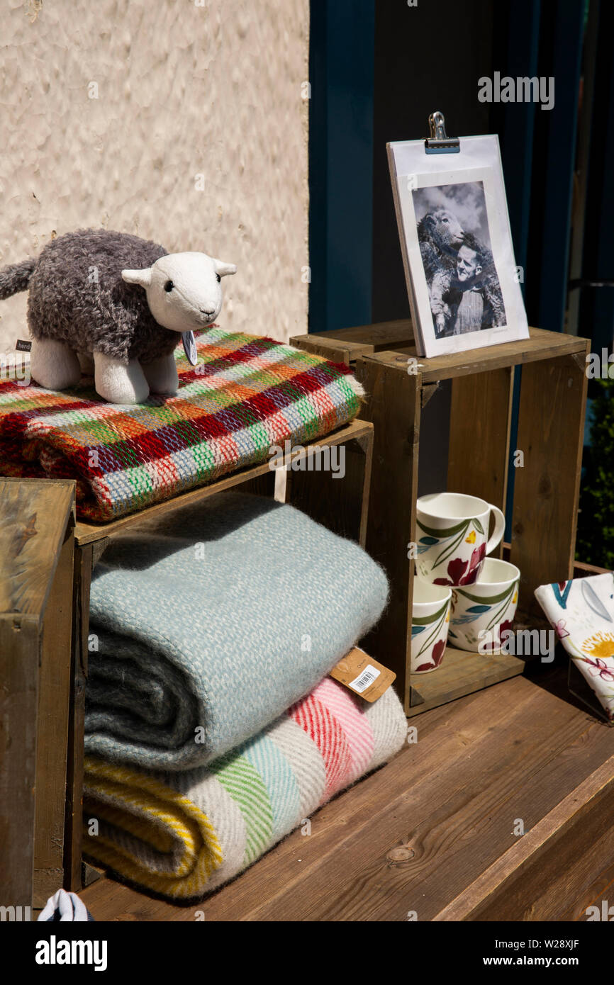 UK, Cumbria, Hawkshead, Flag Street, souvenir crafts, woven woolen blankets, toys, ceramic mugs, for sale outside National Trust shop Stock Photo