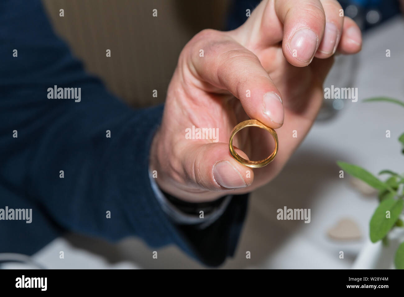 A best man holds the golden wedding ring in the camera, Germany Stock Photo  - Alamy