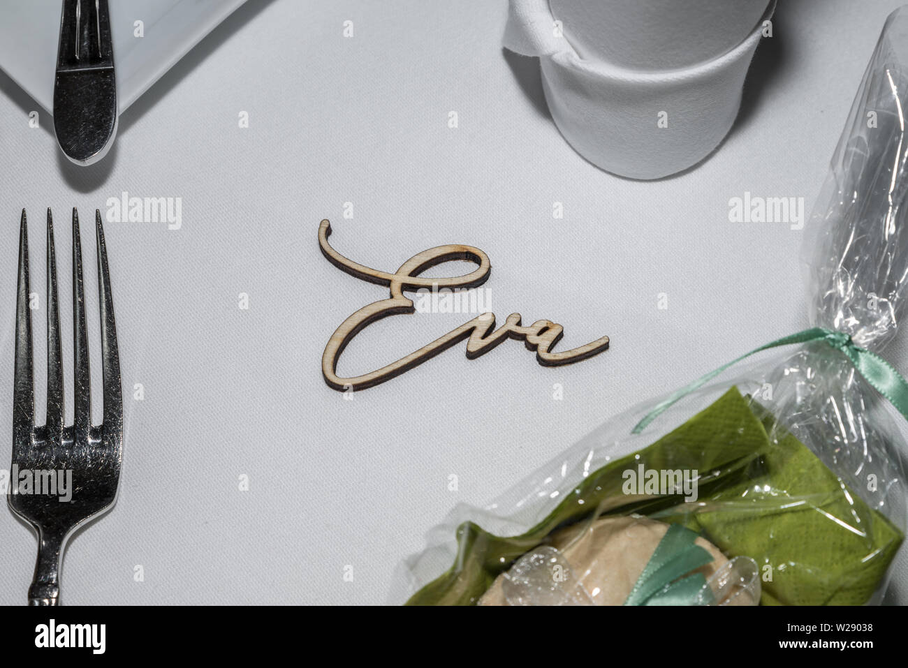 Table decoration of a wedding with glasses of cutlery and the name Eva, Germany Stock Photo