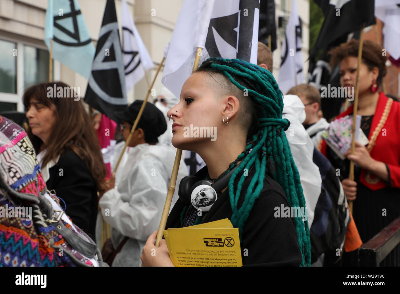 London, UK. 2nd July 2019. Extinction Rebellion Arts and Culture Group creating a silent procession to and theatre in front of several fossil fuel companies. The protest play is based on Bizet's opera Carmen, with real life actors and an opera singer. Pictured: one of the actors and participants of the procession. Credit: Joe Kuis / Alamy News Stock Photo