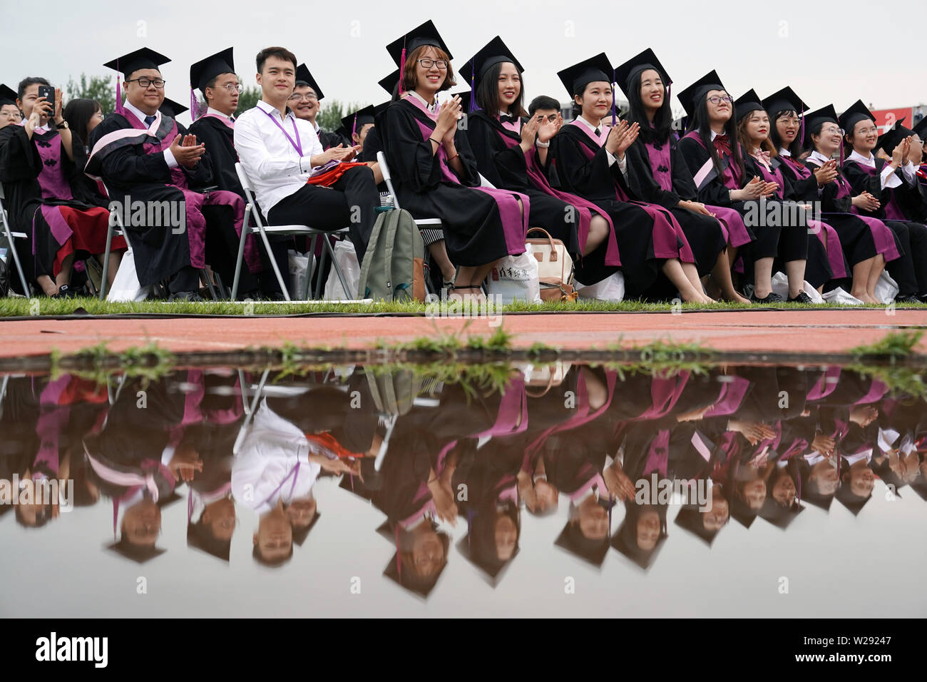 Beijing, China. 7th July, 2019. Graduates attend the 2019 commencement ceremony of Tsinghua University held in Beijing, capital of China, July 7, 2019. Over 3,000 graduates attended the ceremony on Sunday. Credit: Ju Huanzong/Xinhua/Alamy Live News Stock Photo