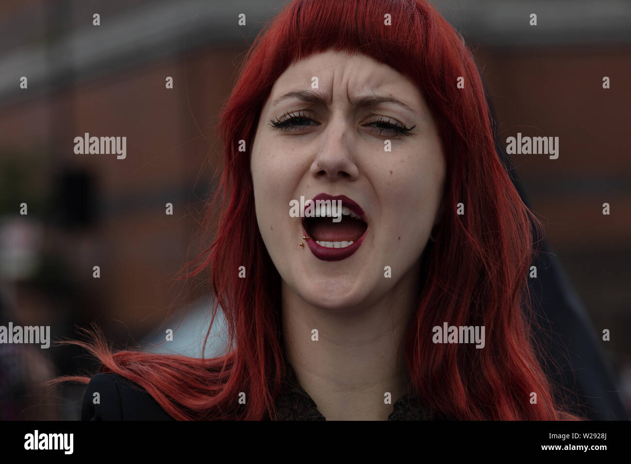London, UK. 2nd July 2019. Extinction Rebellion Arts and Culture Group creating a silent procession to and theatre in front of several fossil fuel companies. The protest play is based on Bizet's opera Carmen, with real life actors and an opera singer. Pictured: actress during the protest. Credit: Joe Kuis / Alamy News Stock Photo