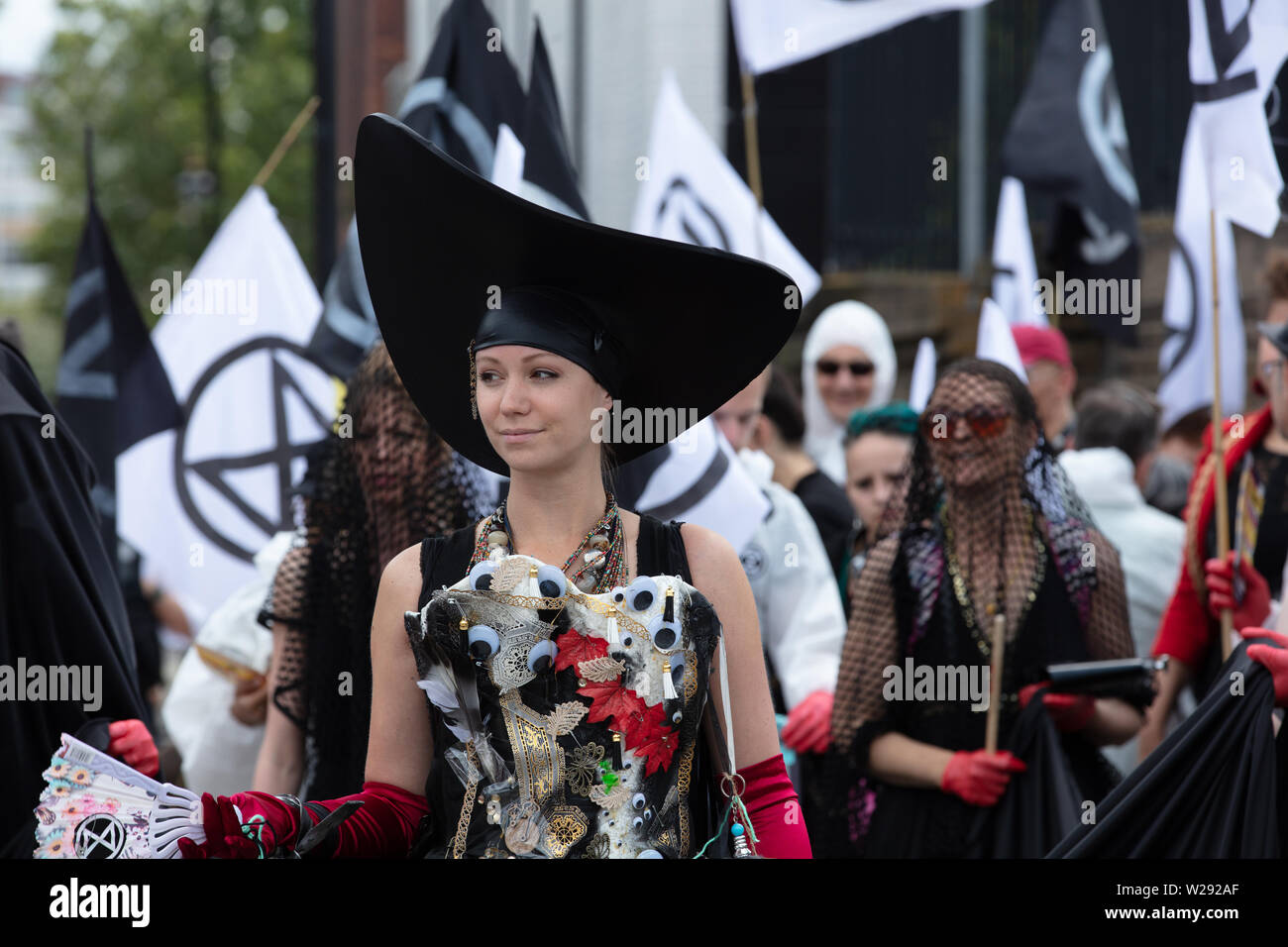 London, UK. 2nd July 2019. Extinction Rebellion Arts and Culture Group creating a silent procession to and theatre in front of several fossil fuel companies. The protest play is based on Bizet's opera Carmen, with real life actors and an opera singer. Credit: Joe Kuis / Alamy News Stock Photo
