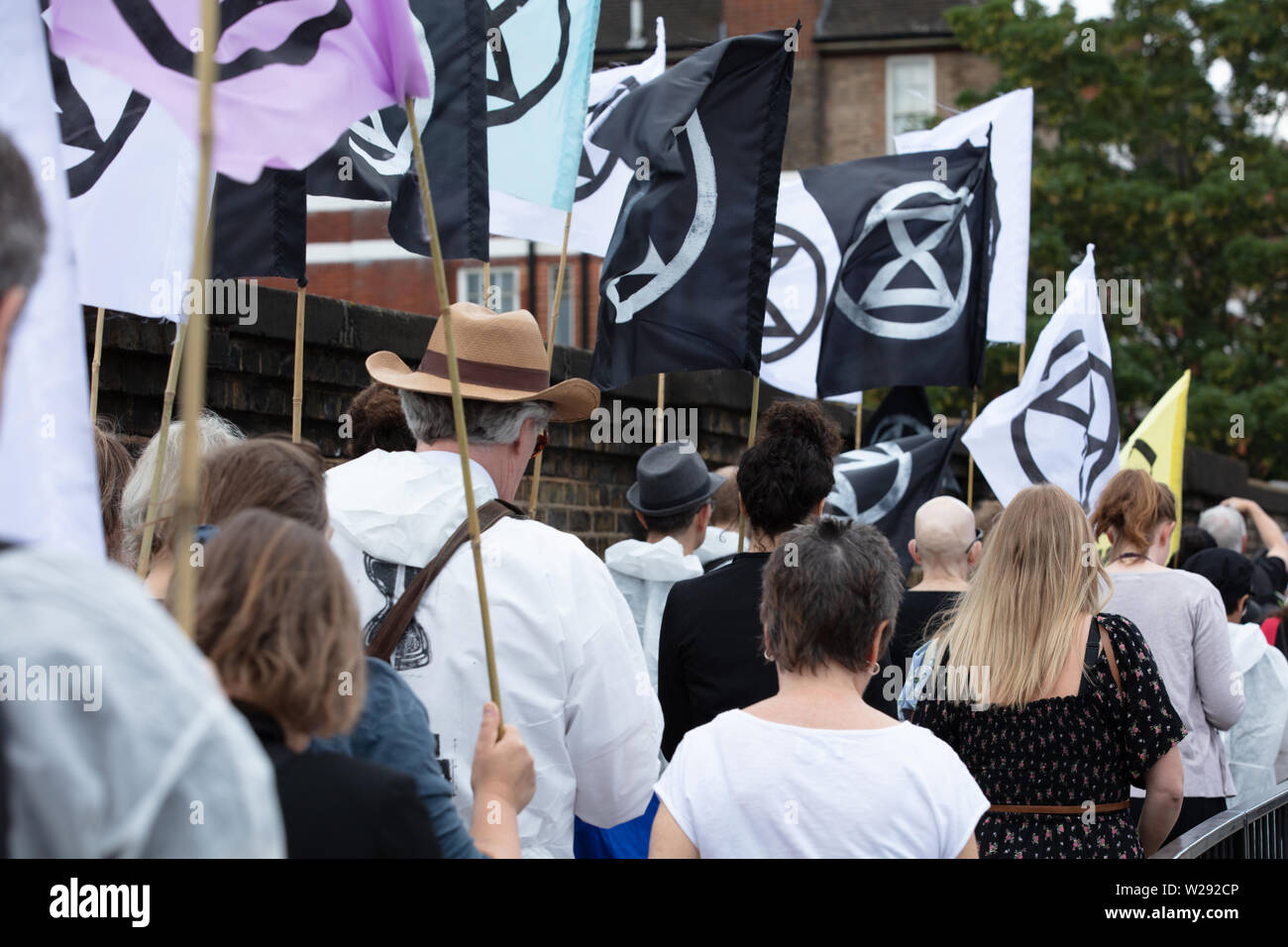 London, UK. 2nd July 2019. Extinction Rebellion Arts and Culture Group creating a silent procession to and theatre in front of several fossil fuel companies. The protest play is based on Bizet's opera Carmen, with real life actors and an opera singer. Credit: Joe Kuis / Alamy News Stock Photo