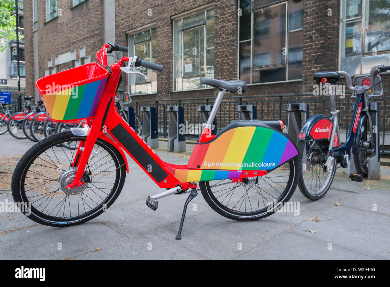 Gay Pride rainbow flag colours on one of Uber's GPS tracked, electric pedal-assist JUMP bikes Stock Photo