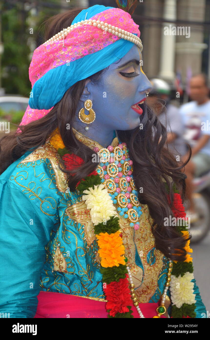 A woman dancer in a colourful parade by The International Society for Krishna Consciousness (ISKCON) in Bangkok, Thailand, on July 7, 2019. The parade started at the Indian Chamber of Commerce on Sathorn Soi 1 and proceeded down Sathorn Road. The Hare Krishna movement or Hare Krishnas, is a Gaudiya Vaishnava Hindu religious organisation founded in 1966 in New York City by A. C. Bhaktivedanta Swami Prabhupada, the Guru and spiritual master  of the organisation. Stock Photo