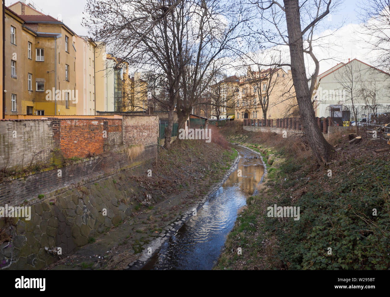 Backyards in Prague, Czech Republica a small stream, the Botič, dividing the rows of apartment blocks Stock Photo