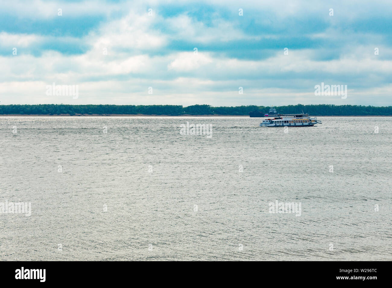 The spring Park is illuminated by the bright sun. View of a large and ...