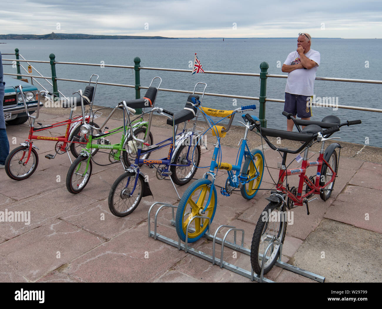 Raleigh Chopper bikes on exhibition outside on seafront at Penzance Stock Photo