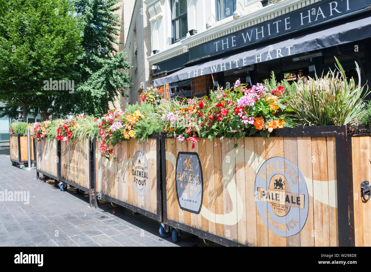 Floral troughs outside the White Hart Pub and Restaurant on Great Suffolk Street, Southwark, London, SE1 Stock Photo
