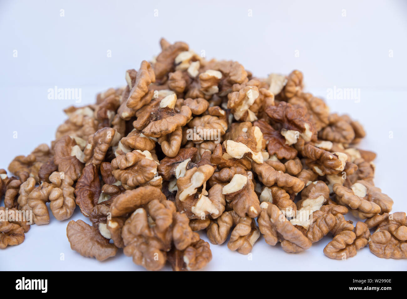 Pile of walnuts isolated on white background. Stock Photo