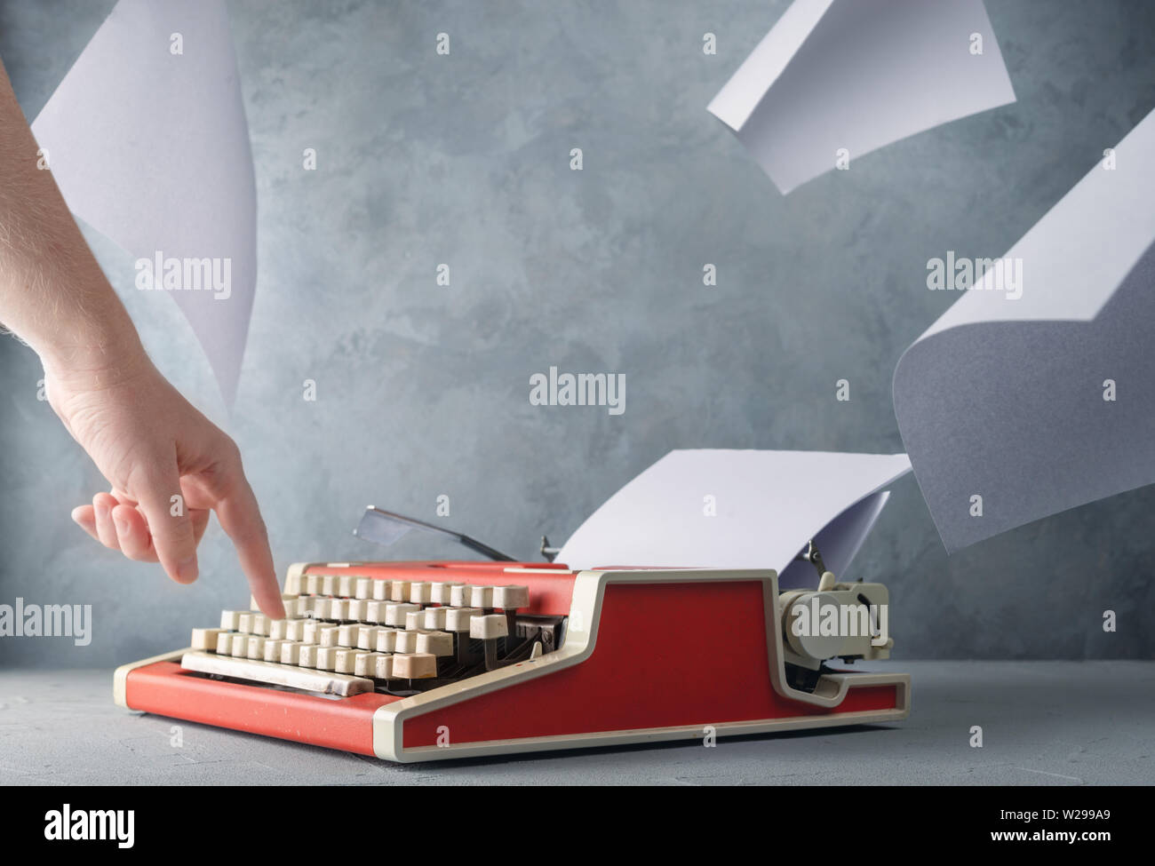 Typewriter on the table and sheets of paper Stock Photo